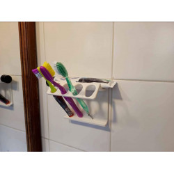 porta cepillos y crema dental.